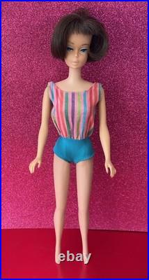 Vintage American Girl Barbie doll withoriginal swimsuit and Barbie outfit