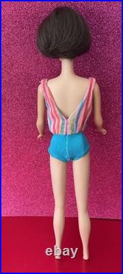 Vintage American Girl Barbie doll withoriginal swimsuit and Barbie outfit